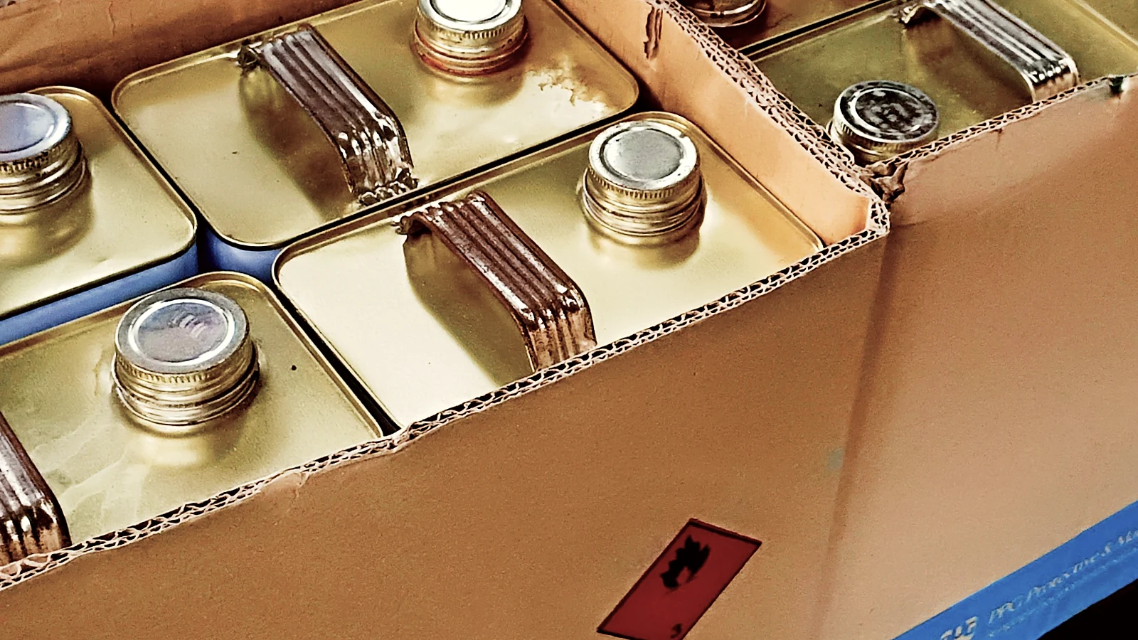 Canisters and cans of aerospace chemistry packed in boxes for dispatch